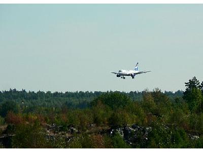 Photo Airplane Landing Over Woods Vehicle