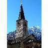 Photo Church Tower With Mountain In Background Building