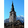 Photo Small Church Tower With Mountain In Background Building